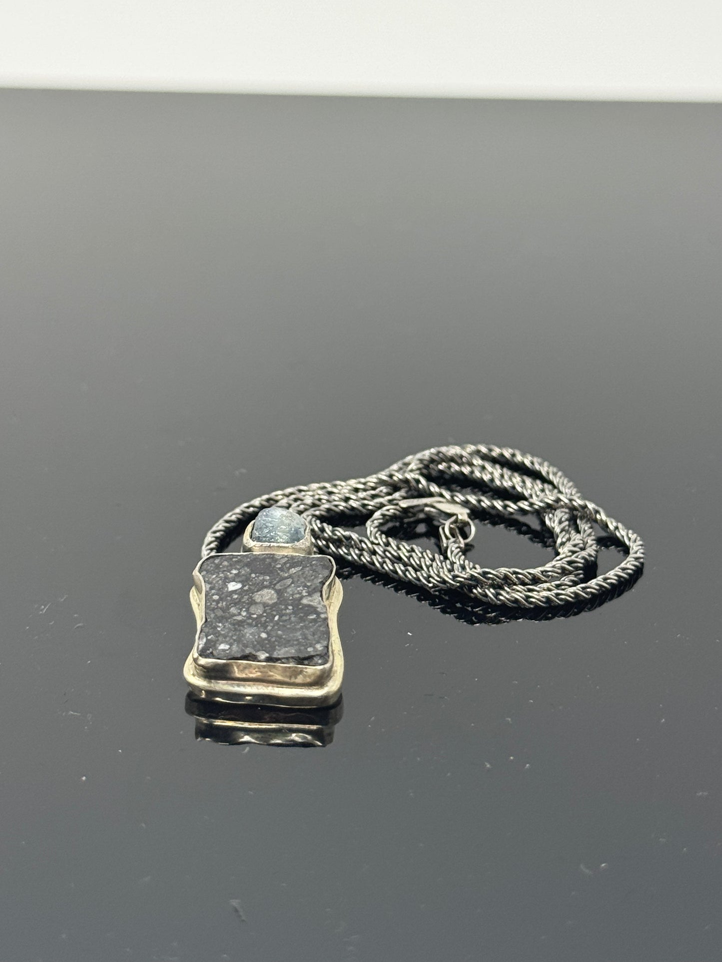 The Surface of the Moon Collection:
Genuine NWA 17679 Lunar Meteorite Silver Necklace w/ Raw Montana Sapphire - Handmade - One of a Kind
