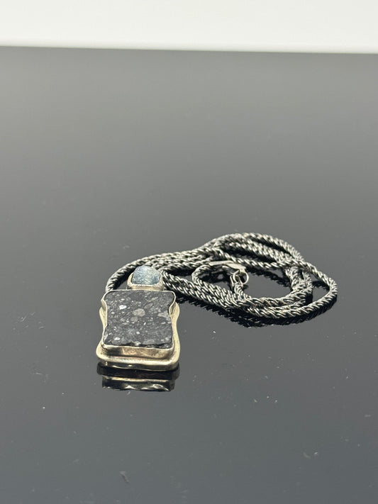The Surface of the Moon Collection: 
Genuine NWA 17679 Lunar Meteorite Silver Necklace w/ Raw Montana Sapphire - Handmade - One of a Kind